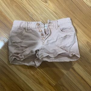 pink distressed shorts